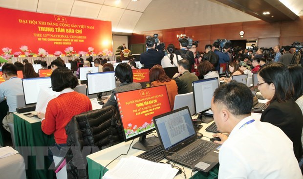 Reporters work at press centre (Photo: VNA)